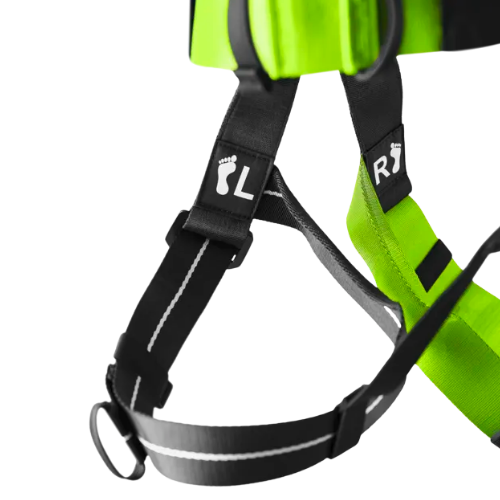 Close-up of a green and black safety harness with reflective straps